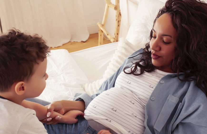 mixed races happy family, african american mother with caucasian son together at home, lifestyle people concept